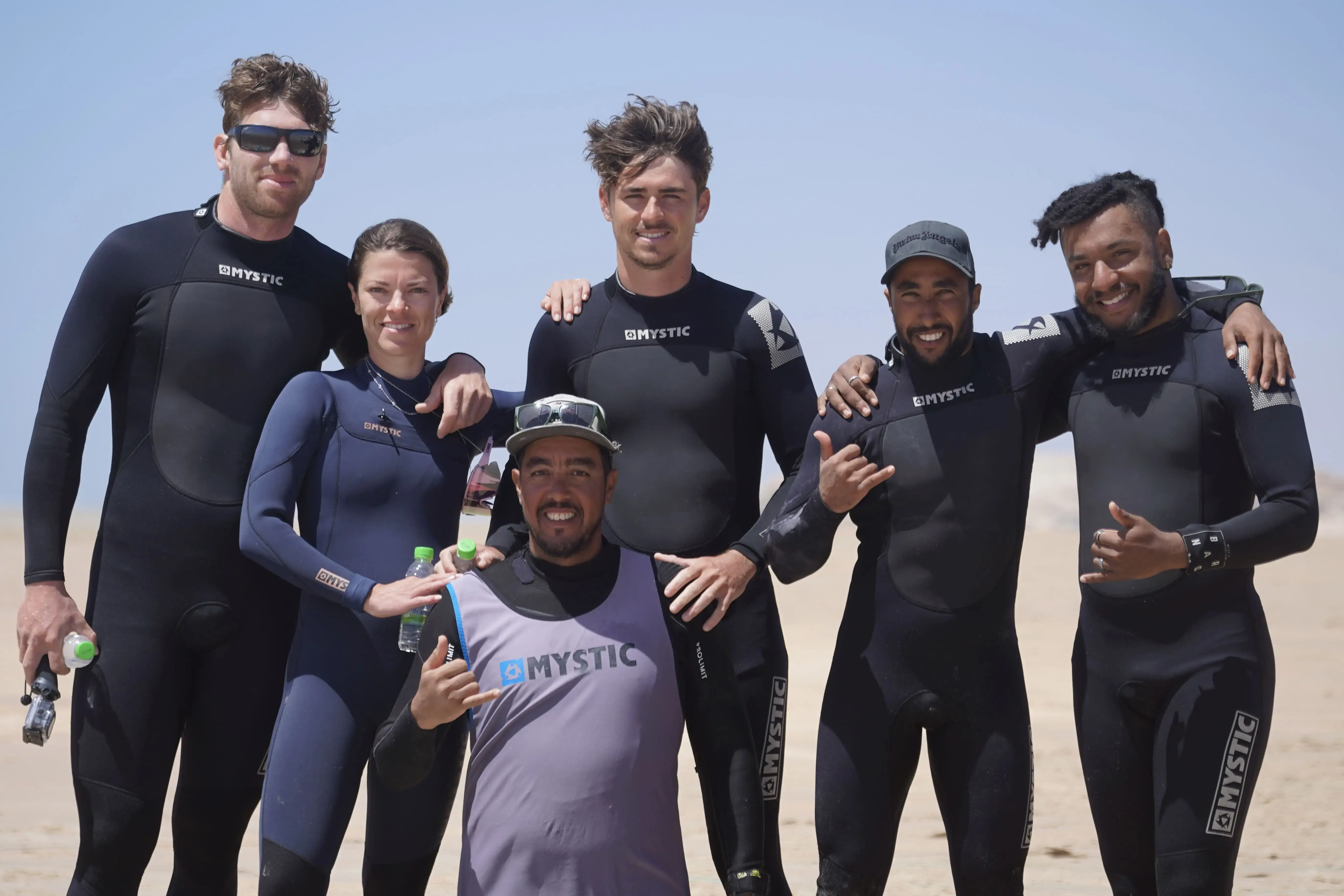 Group of kitesurfing instructors and students on the beach in Morocco